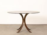 a round table with a glass top and a wooden base