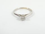 a white gold engagement ring with a single diamond