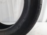 a close up of a tire on a white surface