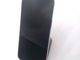 a cell phone that is sitting on top of a stand