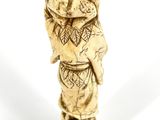 an elephant figurine made out of ivory with a pattern on it ' s body
