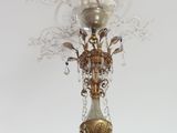 a chandelier hanging from the ceiling in a room