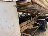 a truck that has a flat bed attached to the back of it