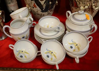 a lot of cups and saucers on a table