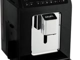 a black coffee machine sitting on top of a white counter