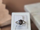 a ring that is sitting in a box on a table