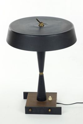 an image of a black table lamp with a clock on it
