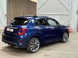 a blue car that is parked in a parking lot