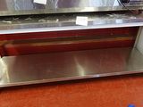 a stainless steel counter with a microwave on it