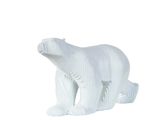 a white polar bear figurine sitting on a white surface