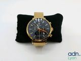 a watch that is sitting on top of a pillow