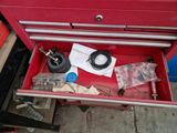 a red tool box with tools inside of it