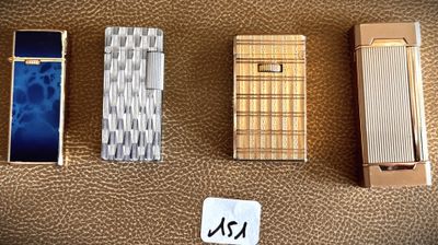 four different types of lighters are lined up on a brown surface