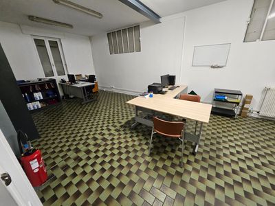 a room with a desk and a chair in it