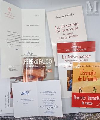 many books and pamphlets on a table next to each other
