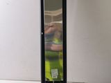 a mirror that is sitting on a stand on a table