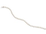 a close up of a white pearl bracelet on a white background