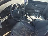 the interior of a car with the door open and the driver ' s seat up