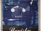 une vieille affiche de cinéma représentant un homme en smoking debout devant une voiture