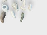 a lot of small objects that are on a white surface
