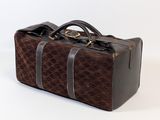 a brown and black bag with a handle on a white background