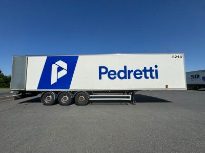 a close up of a semi truck parked in a parking lot