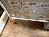a picture of a machine that is sitting on a wooden floor