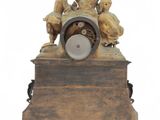 a small clock that is sitting on top of a table