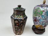two vases sitting next to each other on a table