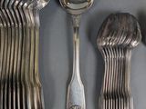 a lot of silver spoons and spoon spoons on a table