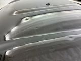 a close up of a car ' s hood with a lot of paint on it