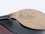 a close up of a tennis racket with a signature on it