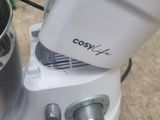 a white blender that is sitting on the floor