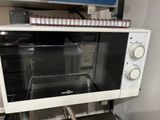 a microwave that is sitting on top of a shelf