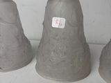 three vases that are sitting on a shelf