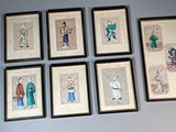 nine framed pictures on the wall of a room