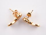 pair of gold plated stud earrings on a white background