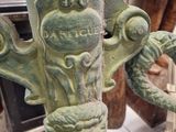 a close up of a green metal object on a table