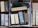 a box full of assorted toy trains in it