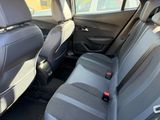 the back seats of a car are empty in a parking lot