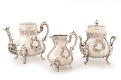 three pieces of silver tea and coffee set on a white background