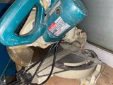 a blue machine that is sitting on top of a wooden floor