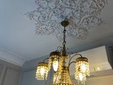 a chandelier hanging from the ceiling in a room