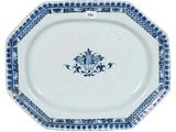 a blue and white plate with a floral design on it
