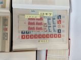 a lot of different stamps on a table with a lot of them