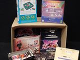 a box full of games and other items on a table