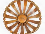 an image of a wooden plate with a circular design on it