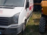 a white van that is parked next to a dump truck