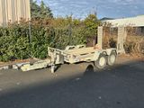 a trailer that is parked on the side of the road