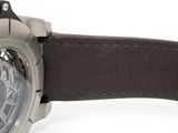 a close up of a watch on a white surface